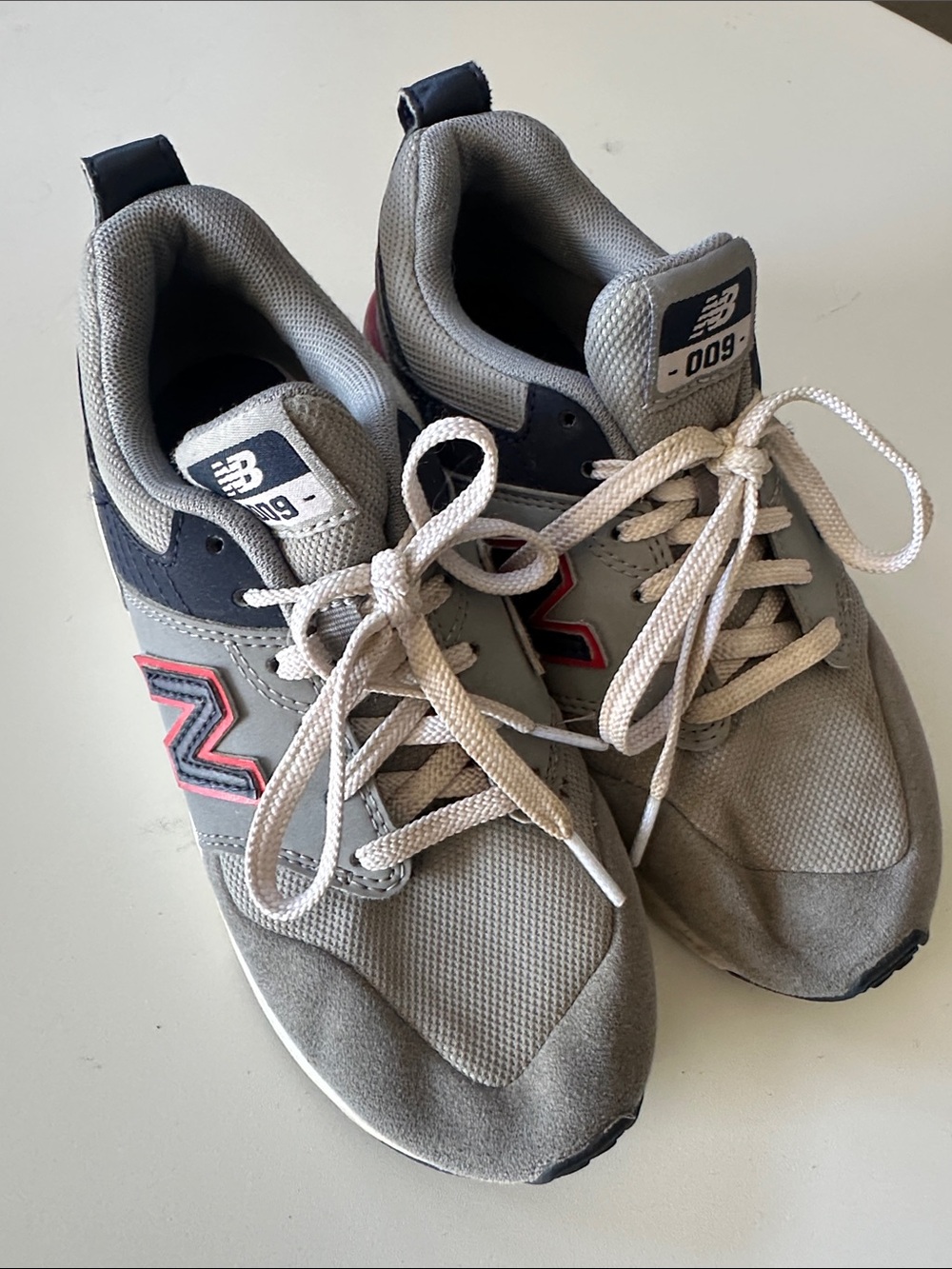 New Balance Grey Sneakers with Navy and Red Accents